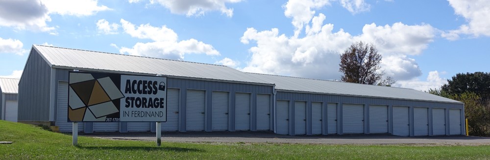 Enclosed vehicle parking and large units with white doors at Mississippi St facility, featuring wide driveways for easy access."